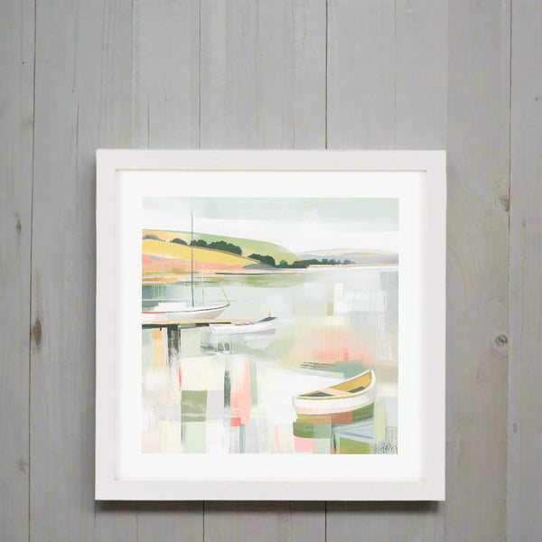 Framed artwork of a coastal scene with boats on a white background