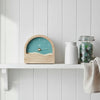 Wooden thermometer with ocean design on a light gray background