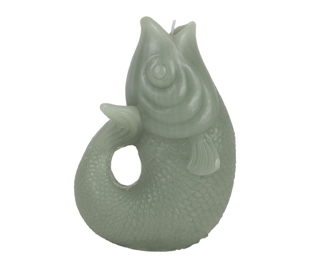 Sea green fish shaped sculptural candle on white background