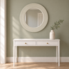Clifton round ivory mirror above a white Amerlie console against a sage painted wall
