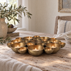 Lucienne antique brass tealight centrepiece styled on a reclaimed wood table