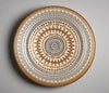Decorative plate with geometric pattern on a white background