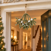 Winter Kiss olive green felt mistletoe with white berries hanging centrally above an open front doorway